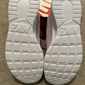Nike Tanjun kids running shoe.  Never worn.